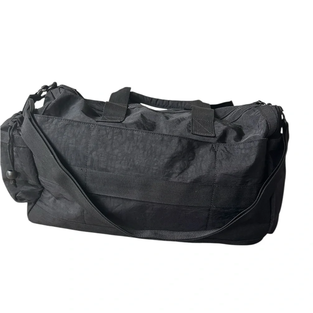 Tommy Bahama black travel duffle bag with hand and shoulder straps
